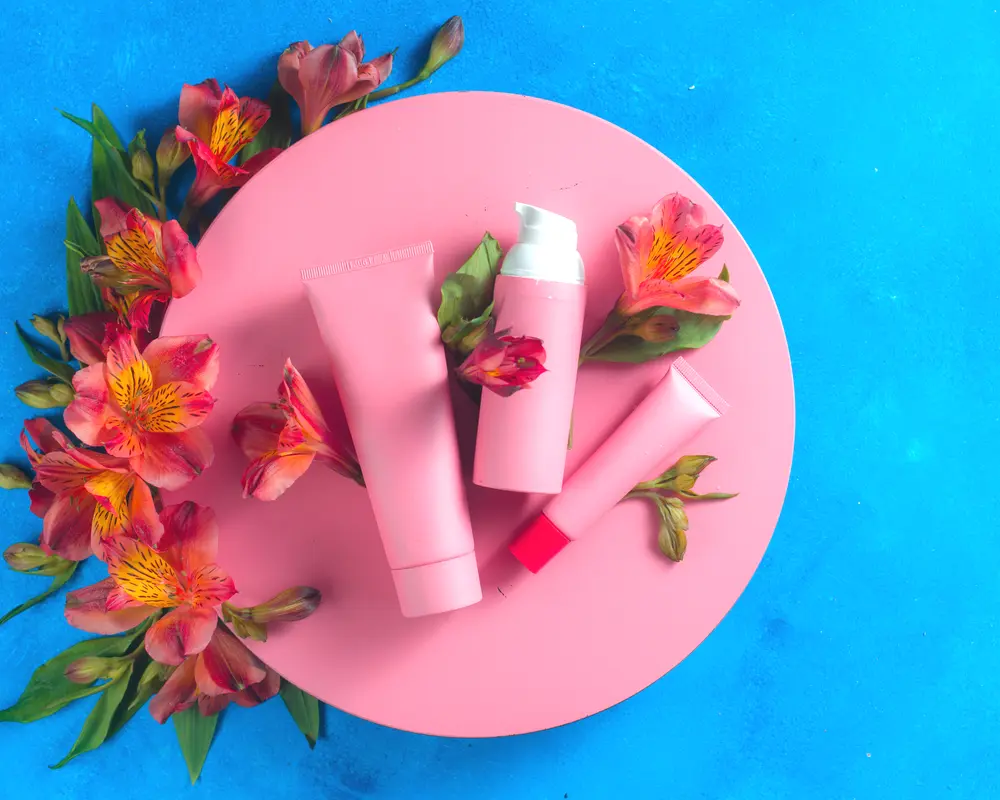 pink skincare bottles with flowers