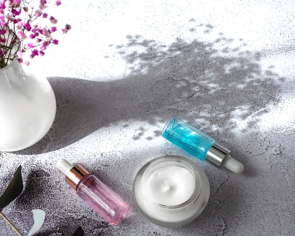 skincare products and flowers on